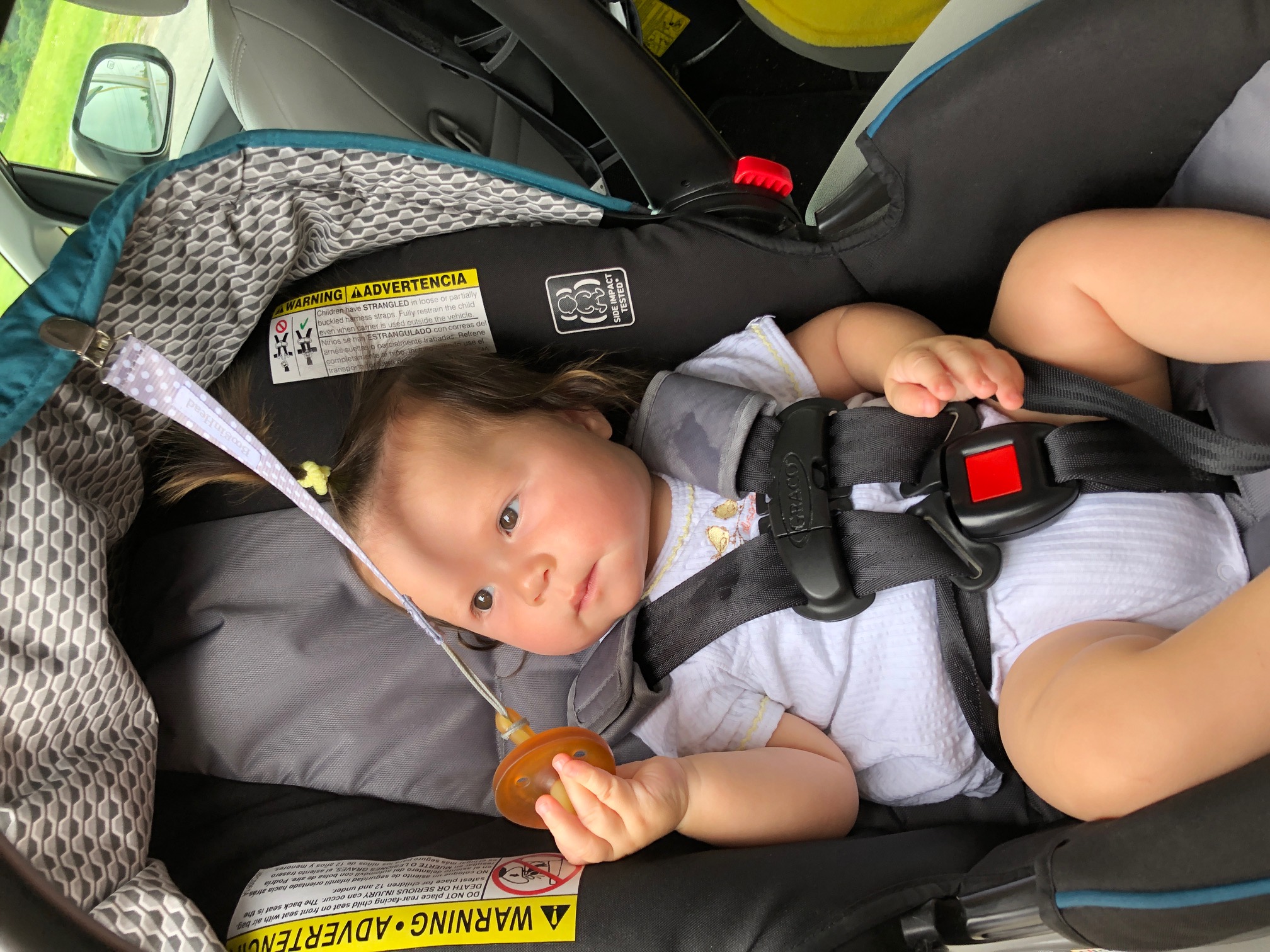 Baby in Car Seat with Natursutten Pacifier